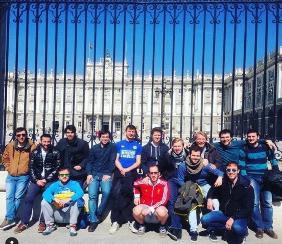 The team in front of the Royal Palace in Madrid